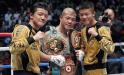 Koki Kameda of Japan, center, donning the newly-captured champion belt, green, in addition to the two he already has, poses with his younger brothers Daiki, left, and Kazuki after Koki's victory over Alexander Munoz of Venezuela in their 12-round WBA bantamweight world title boxing bout in Saitama, Japan, Sunday, Dec. 26, 2010. Koki Kameda won a unanimous decision over Munoz to take the vacant title. (AP Photo/Shizuo Kambayashi)